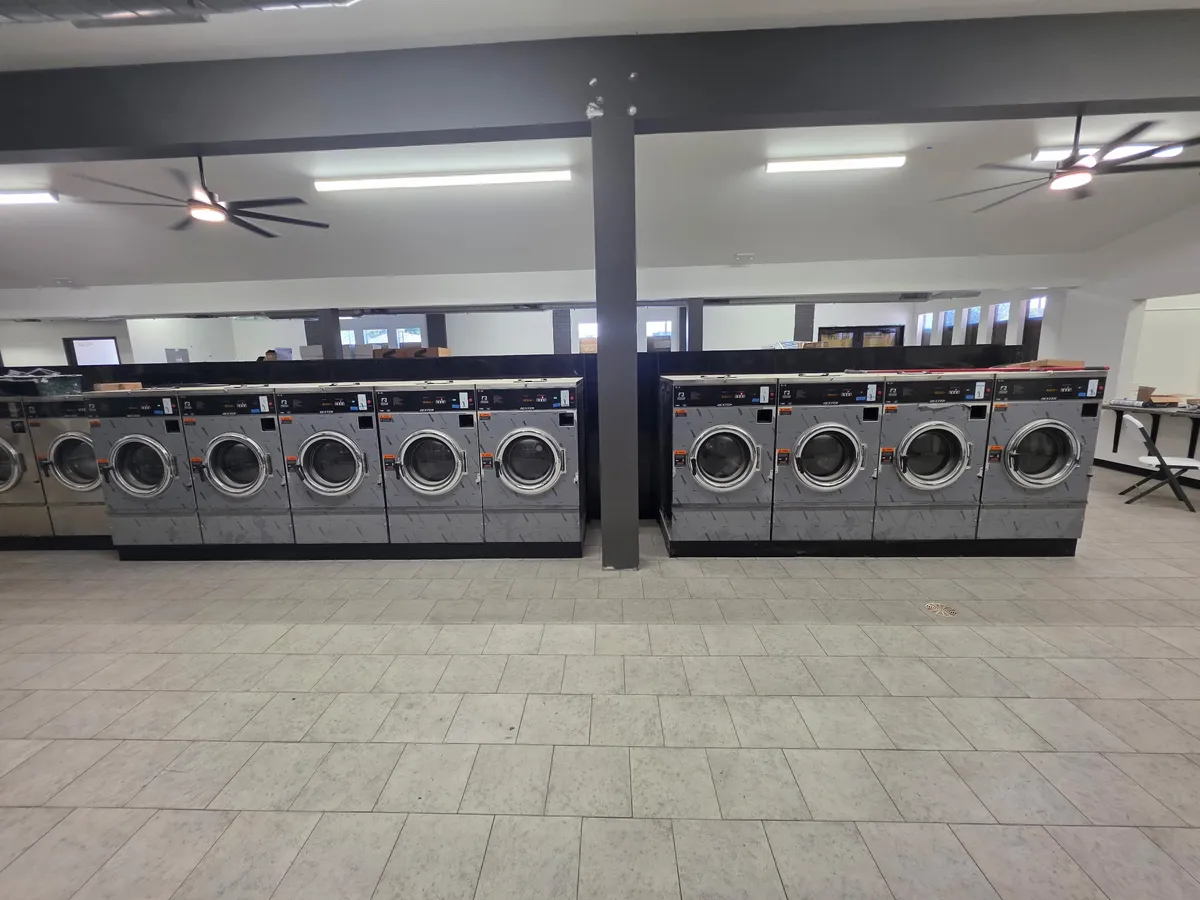 Finished laundromat with installed rows of washers